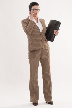 modern business woman on the phone with timer in handの写真素材