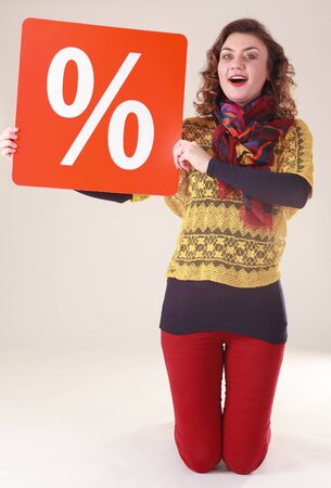 Young attractive woman with red percent sign for the final saleの写真素材