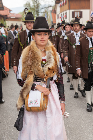Beautiful young Markedenterinprovider with genuine fox fur around the neck and a barrel of brandy around the shoulderのeditorial素材
