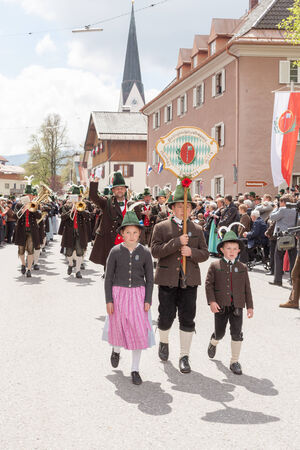 Band of mountain troops Parsberg at the parade on Patronatstag with childrenのeditorial素材