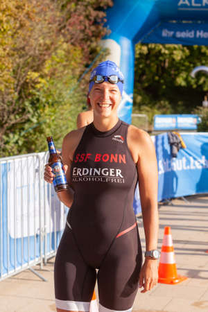 Ratingen, Germany - September 20, 2020: Participant in swimsuit with isotonic beer before the start at the 12th Stadtwerke Ratingen Triathlonのeditorial素材