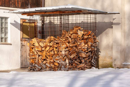 A pile of wooden logs held together with construction latticeの写真素材
