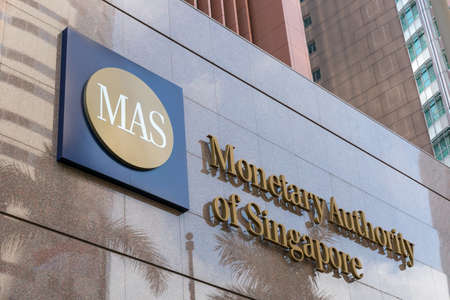 Monetary Authority of Singapore (MAS) logo signage on the building at entrance.のeditorial素材