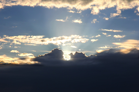 Sun through cloudsの写真素材