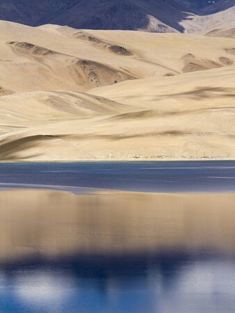 Tsomoriri mountain lake panorama with mountains and blue sky reflections in the lake  north India の写真素材