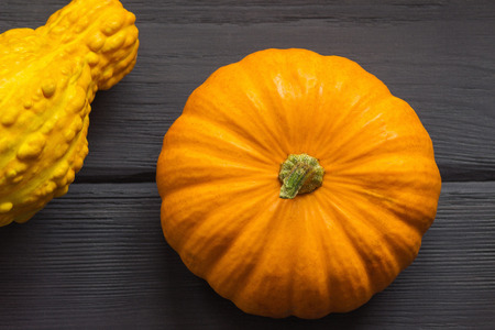 Decorative pumpkin on wooden backgroundの写真素材