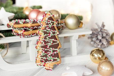 Christmas cookies on wooden sledge. Beautiful Christmas background の写真素材