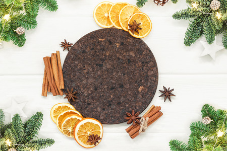 Ingredients for Mulled wine recipe. Orange, cinnamon sticks, anise, and fir branches. Christmas motive. Top view, copy spaceの写真素材