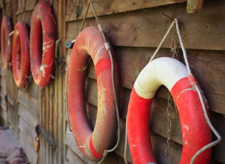 Lifebuoys on the wooden wallの写真素材