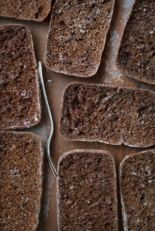 Sliced rye bread on a rustic background