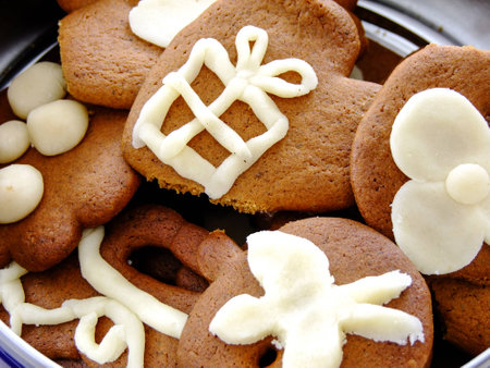 Closeup of Gingerbread Cookies decorated with Marzipan in metal Box