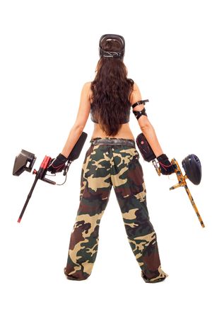 Sexy young girl posing like playing paintballの写真素材