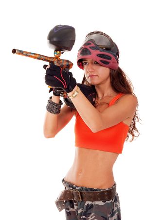 Sexy young girl posing like playing paintballの写真素材