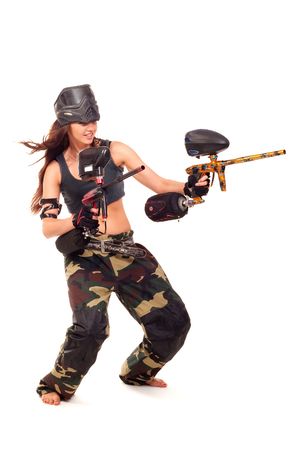 Sexy young girl posing like playing paintballの写真素材