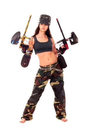Sexy young girl posing like playing paintballの写真素材