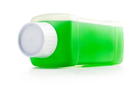 Transparent plastic bottle with green cleaning liquid. Lying horizontal.の写真素材