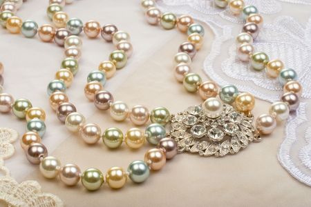 Necklace on lace background closeupの写真素材