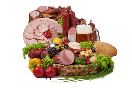 A composition of meat and vegetables with a pot full of beer isolated on white. の写真素材