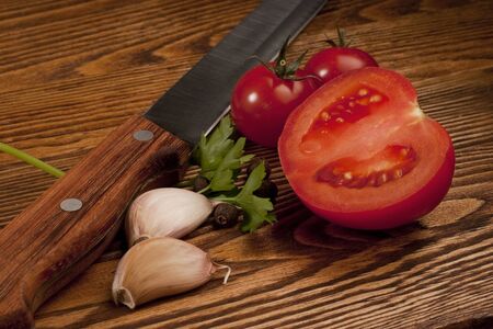 Tomatoes on the old wooden table