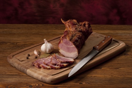Composition with smoked ham on the tableの写真素材
