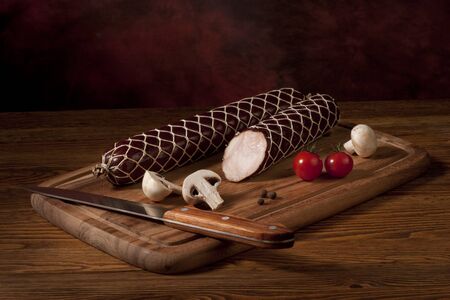 Composition with sausage on the tableの写真素材
