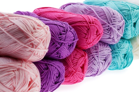 Set of colorful wool yarn wrapped in hanks. Close-up