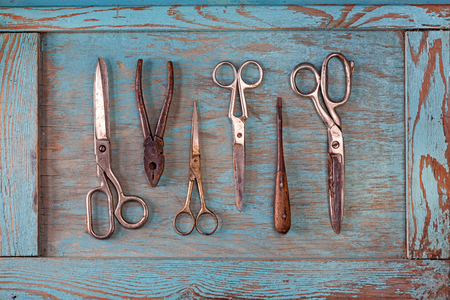 Collection of vintage tools on a blue wooden background