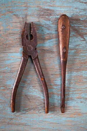 Vintage tools on a blue wooden background