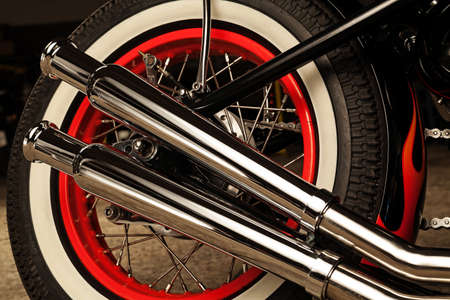 Custom bobber motorbike in an workshop garage.