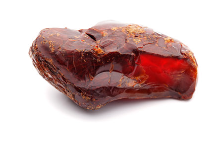 Natural amber. A piece of yellow opaque natural amber on white background.の写真素材