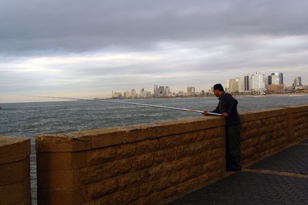 waiting for fish fishermanの写真素材