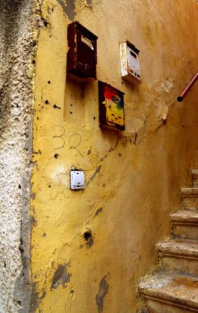 Old mailboxes on the textured wallの写真素材