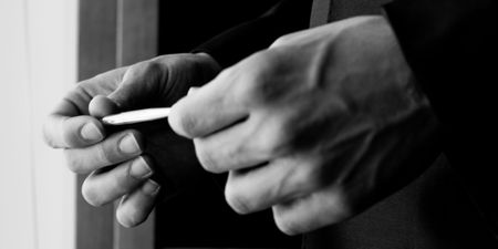 black and white picture of businessman with his pen in handsの写真素材