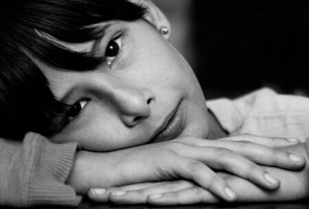 black and white picture of happy child in relaxing pose