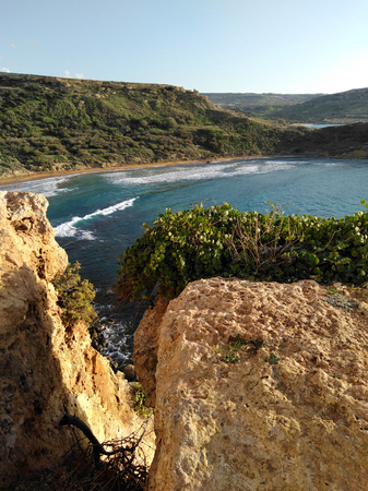 Comino island blue lagoon. Malta blue turquoise sea water beach. Rock and cliff sunny seashore. Travel mediterranean.の写真素材