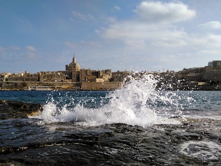 Malta Old city Valetta view with sea wave spalshの写真素材