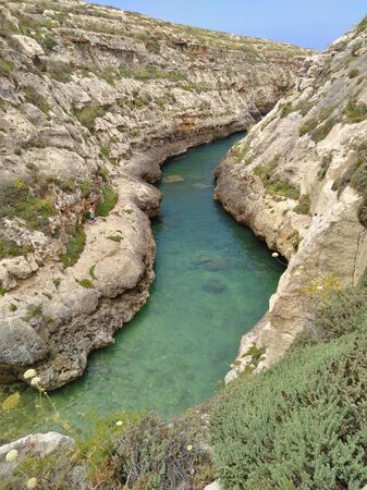 Narrow bay isolated under blue skyの写真素材