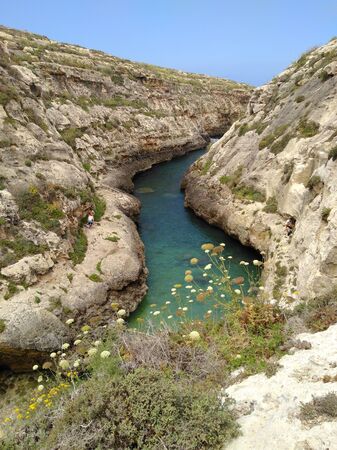 Narrow bay isolated under blue skyの写真素材