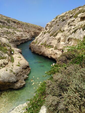 Narrow bay isolated under blue skyの写真素材