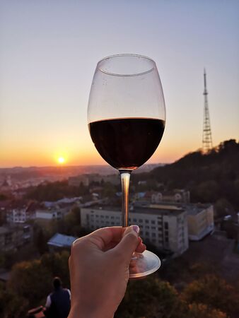 Swirl wine outdoor with handの写真素材