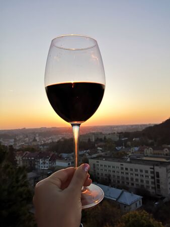 Swirl wine outdoor with handの写真素材