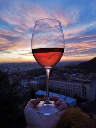 Swirl wine outdoor with handの写真素材