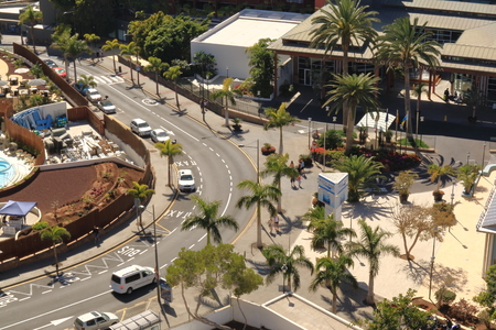 Playa Paraiso, Tenerife, Spain 02.16.2018: view to the street near Hard Rock hotel from the air, big blue swimming pool and green area around.のeditorial素材