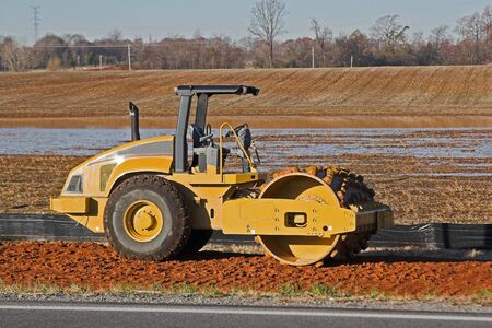 Dirt packing machine working on new highway