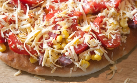 delicious pizza with potatoes, cheese and meetの写真素材
