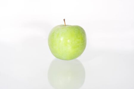 Green ripe apple isolated on white backgroundの写真素材