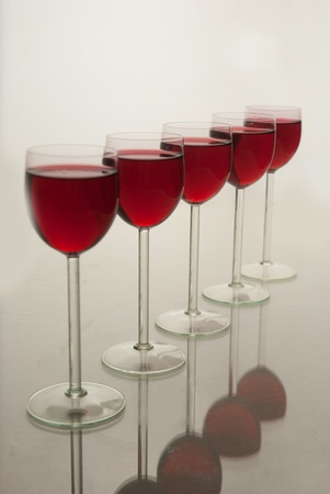 Wine glasses standing in a rowの写真素材