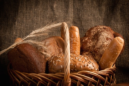 assortment of baked bread on sacking