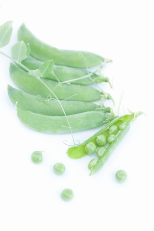 Sweet green peas on whiteの写真素材