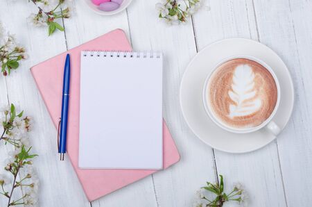 Creative flat lay of workspace desk, notepad for wishlist and lifestyle objects on wooden backgroundの写真素材
